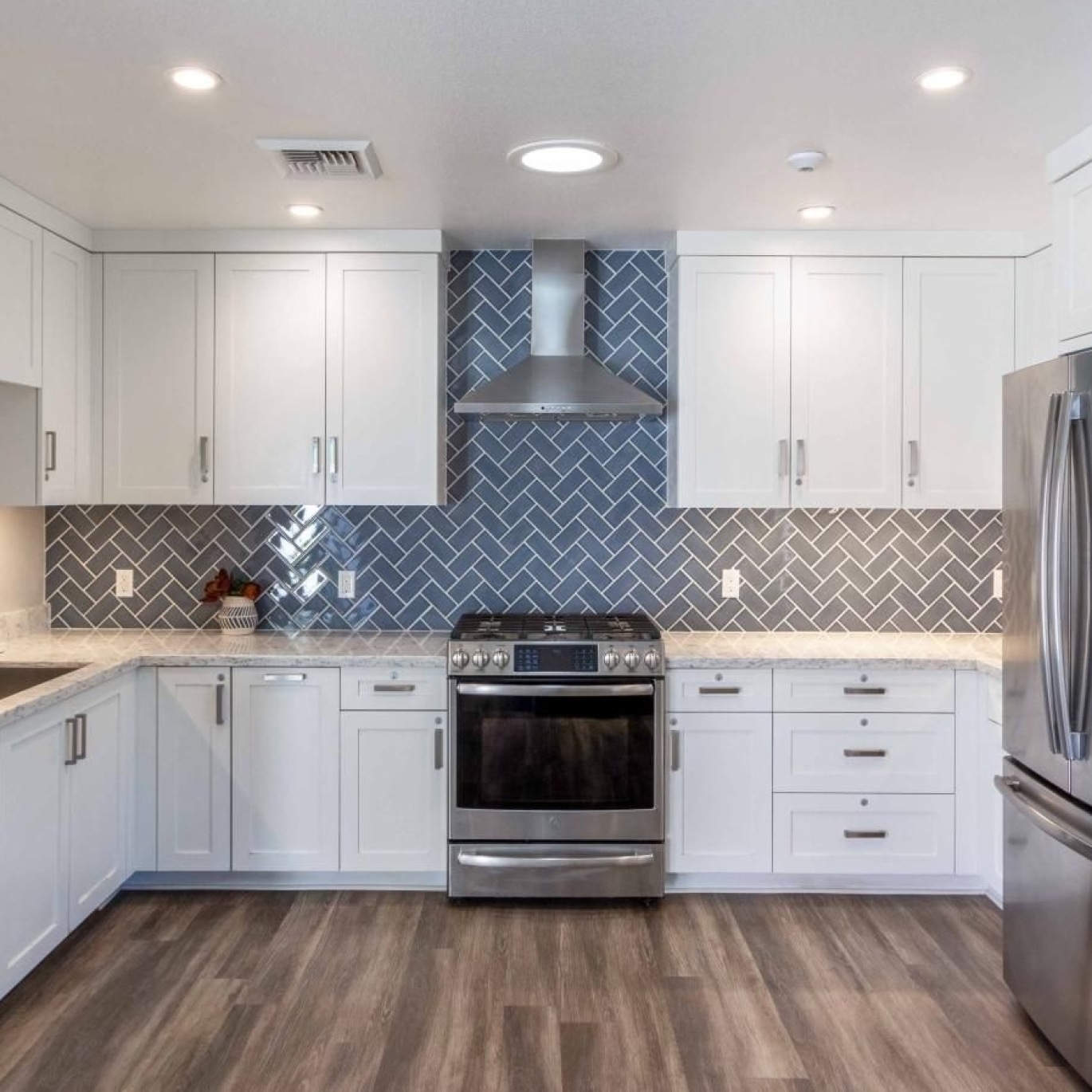 a kitchen with white cabinets