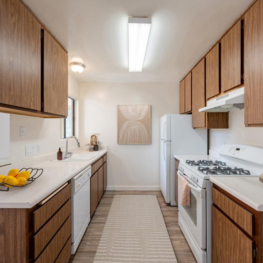 a kitchen with wooden cabinets